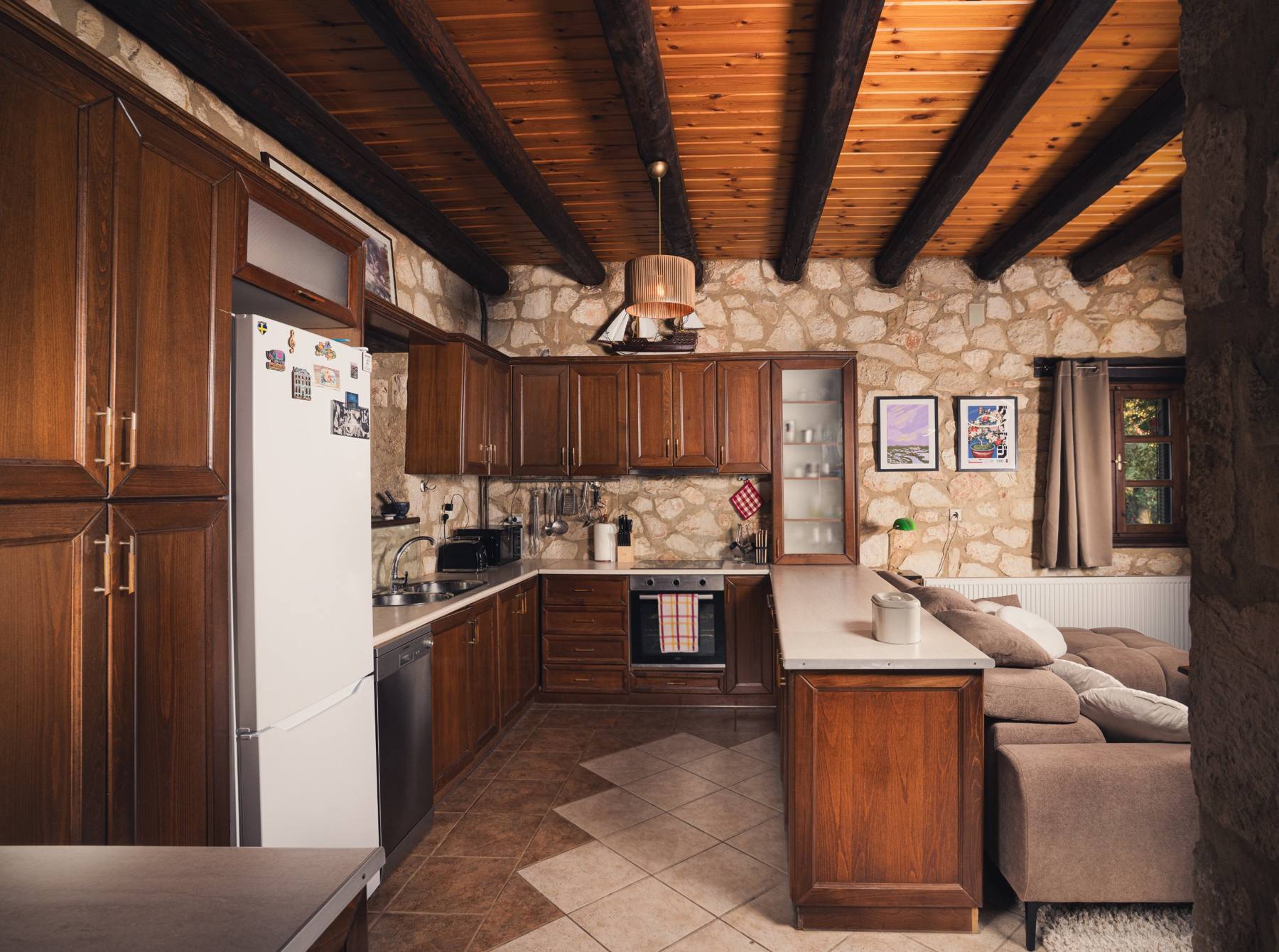 Kitchen with a white fridge and wooden cabinets