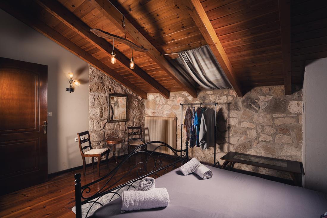 Bedroom with a clothes rail and wooden floor