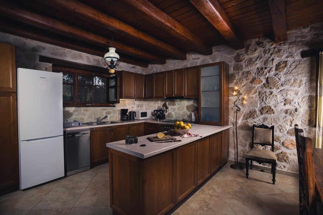 Kitchen with a white fridge and wooden cabinets