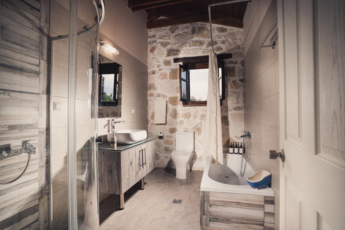 Bathroom with a shower cabin and bathtub
