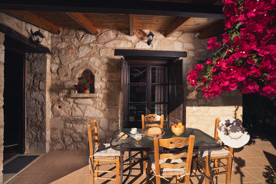Terrace table framed by bougainvillea